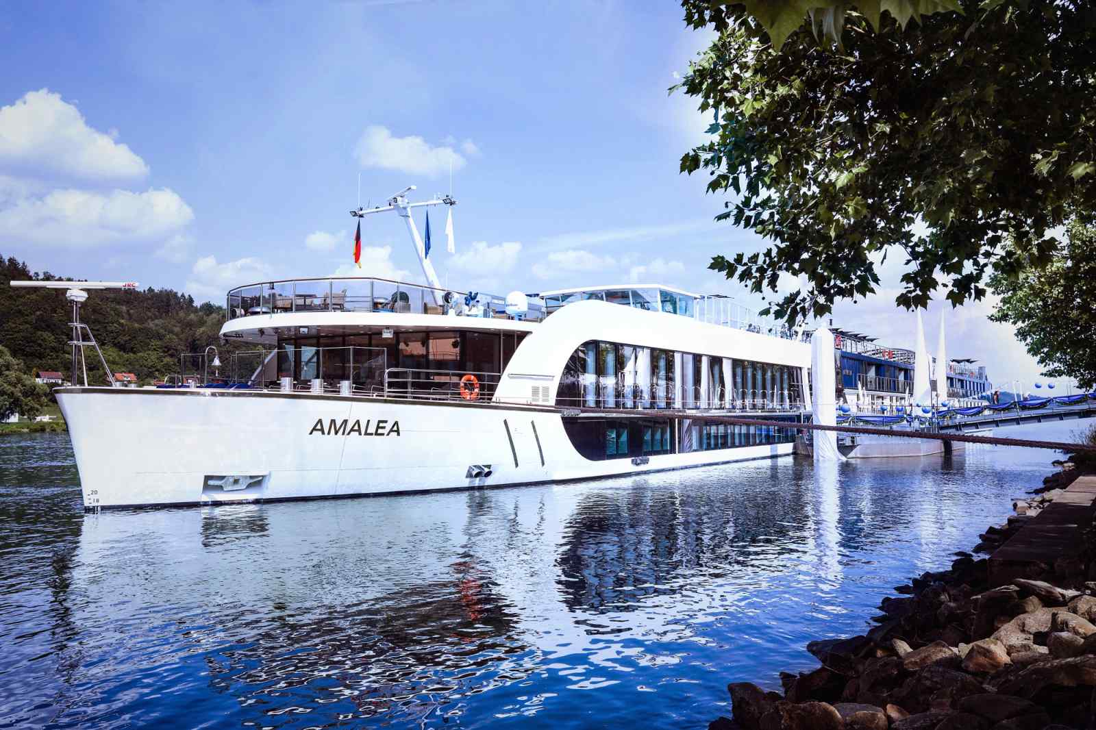 AmaLea river cruise ship docked at a picturesque riverside port