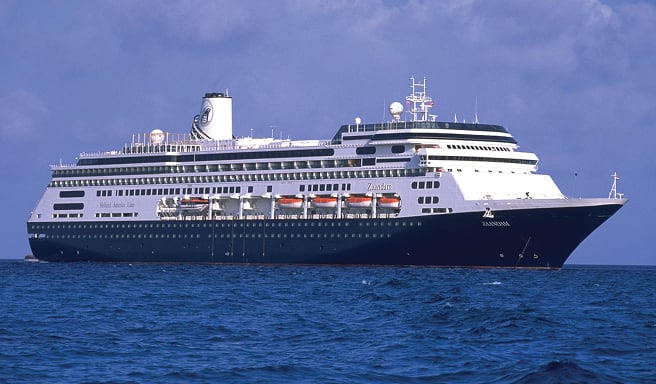 Blue Ocean Cruise Ship at Sea A sleek, modern cruise ship with a dark blue and white color scheme sailing on blue ocean waters