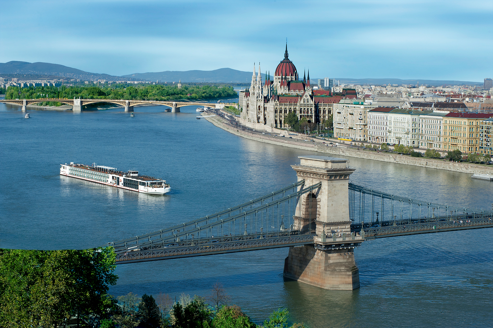 A scenic view of Budapest showcasing the iconic Chain Bridge, the Hungarian Parliament Building