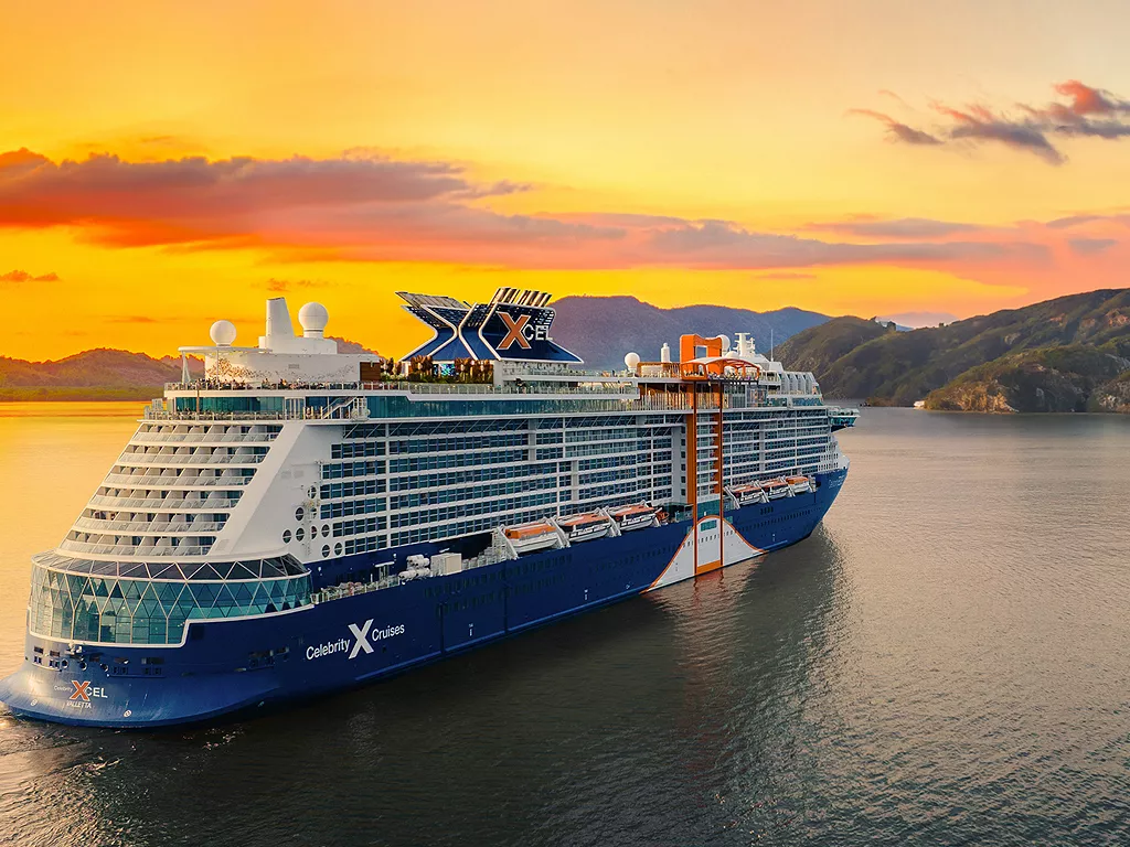 Celebrity Cruise Ship at Sunset A large Celebrity Cruises ship anchored in calm waters with a dramatic golden sunset