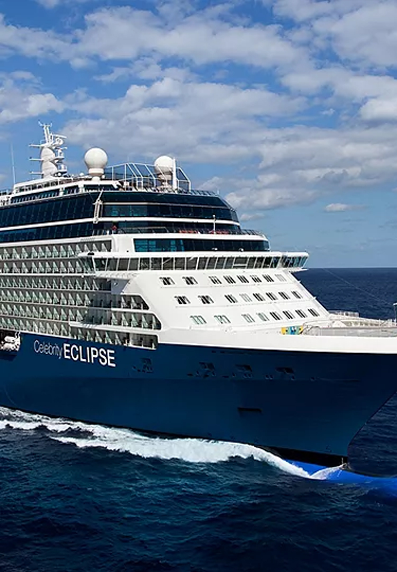 Celebrity Eclipse Cruise Ship at Sea A modern Celebrity Cruises Eclipse-class cruise ship sailing on blue ocean waters under a cloudy