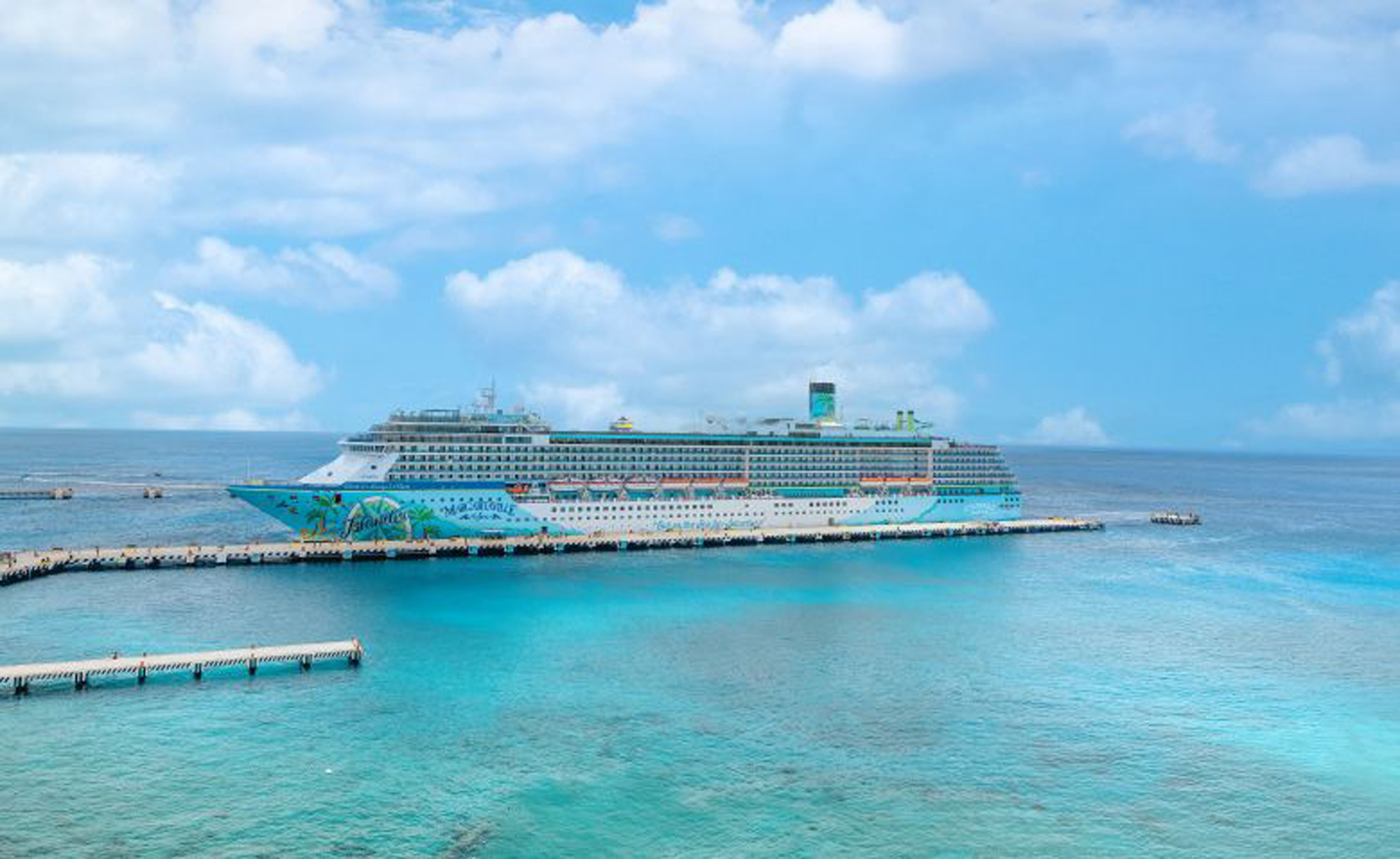 Cruise Ship Docked in Turquoise Caribbean Waters Colorful Margaritaville at Sea cruise ship docked at tropical Caribbean port with turquoise waters