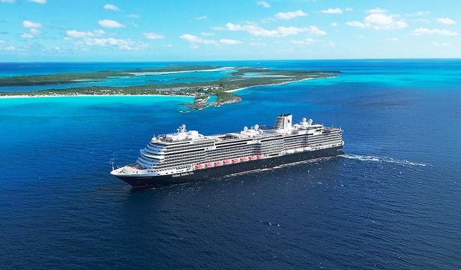 Cruise Ship Sailing Near Tropical Island A large, modern cruise ship navigating through turquoise waters near a lush green island with