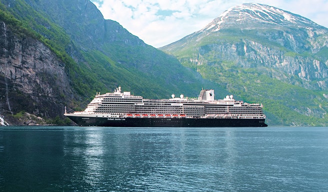Cruise Ship in Norwegian Fjord A modern cruise ship sailing through a stunning fjord with steep green mountainsides