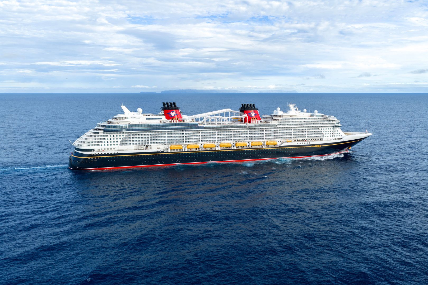 Disney cruise ship navigating open ocean waters