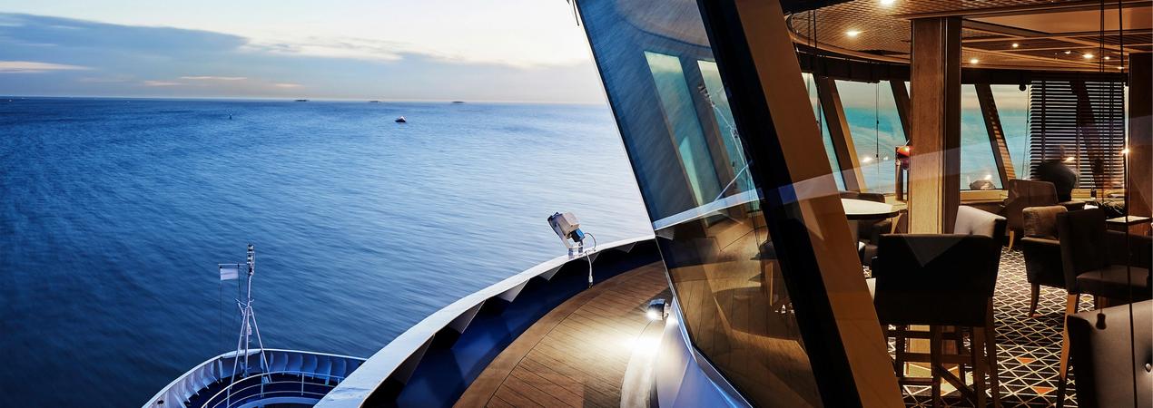 Luxury cruise ship observation lounge with panoramic ocean views