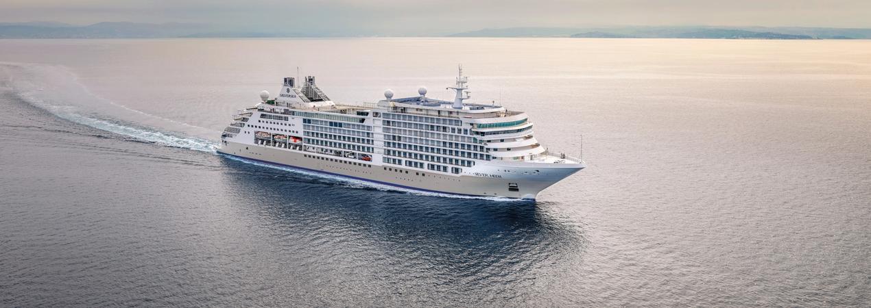 Silversea luxury cruise ship at sea with misty horizon