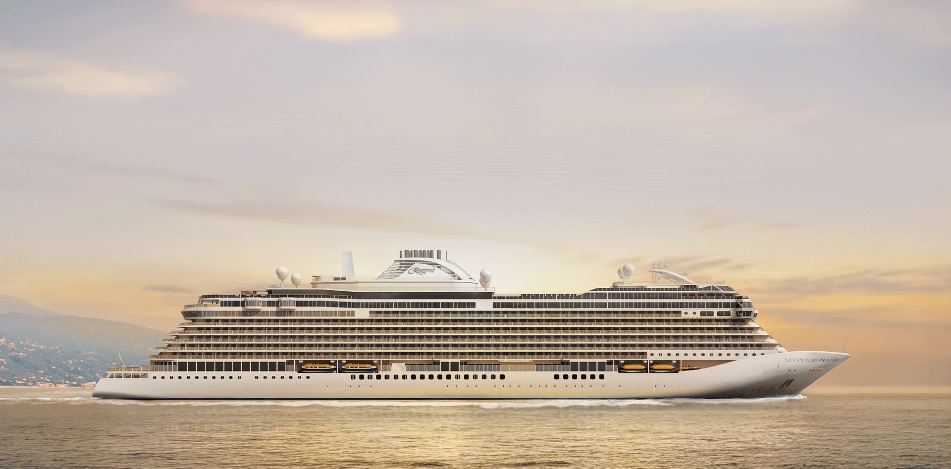 Regent Seven Seas luxury cruise ship at sunset with mountains in the background