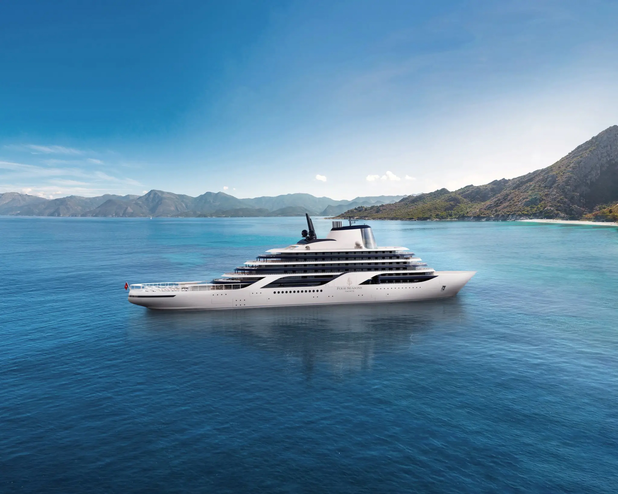 Four Seasons I luxury yacht anchored in a scenic mountain bay with turquoise waters