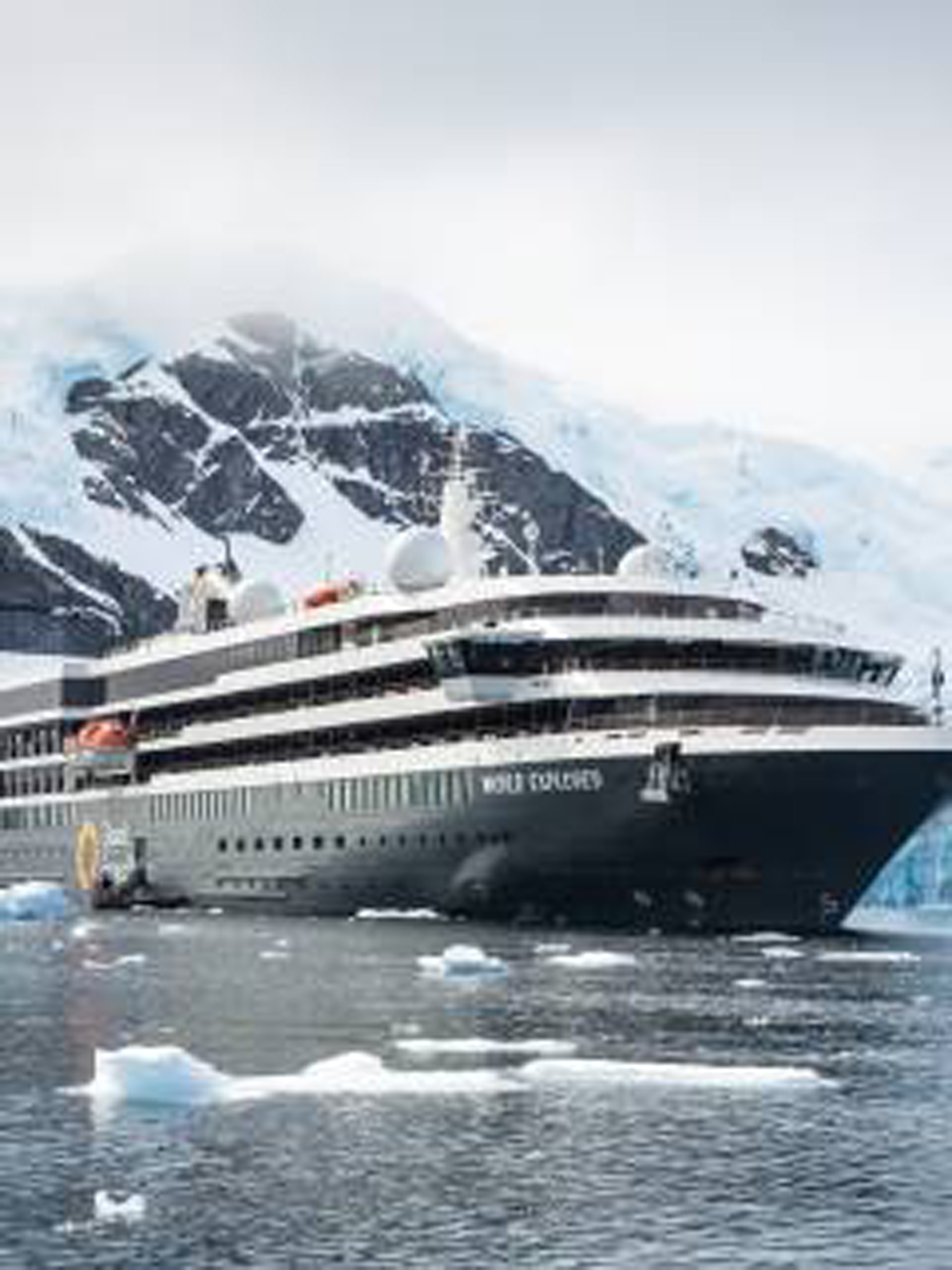 Luxury Expedition Cruise in Antarctic Waters A modern expedition cruise ship navigating through icy waters with snow-capped mountains in