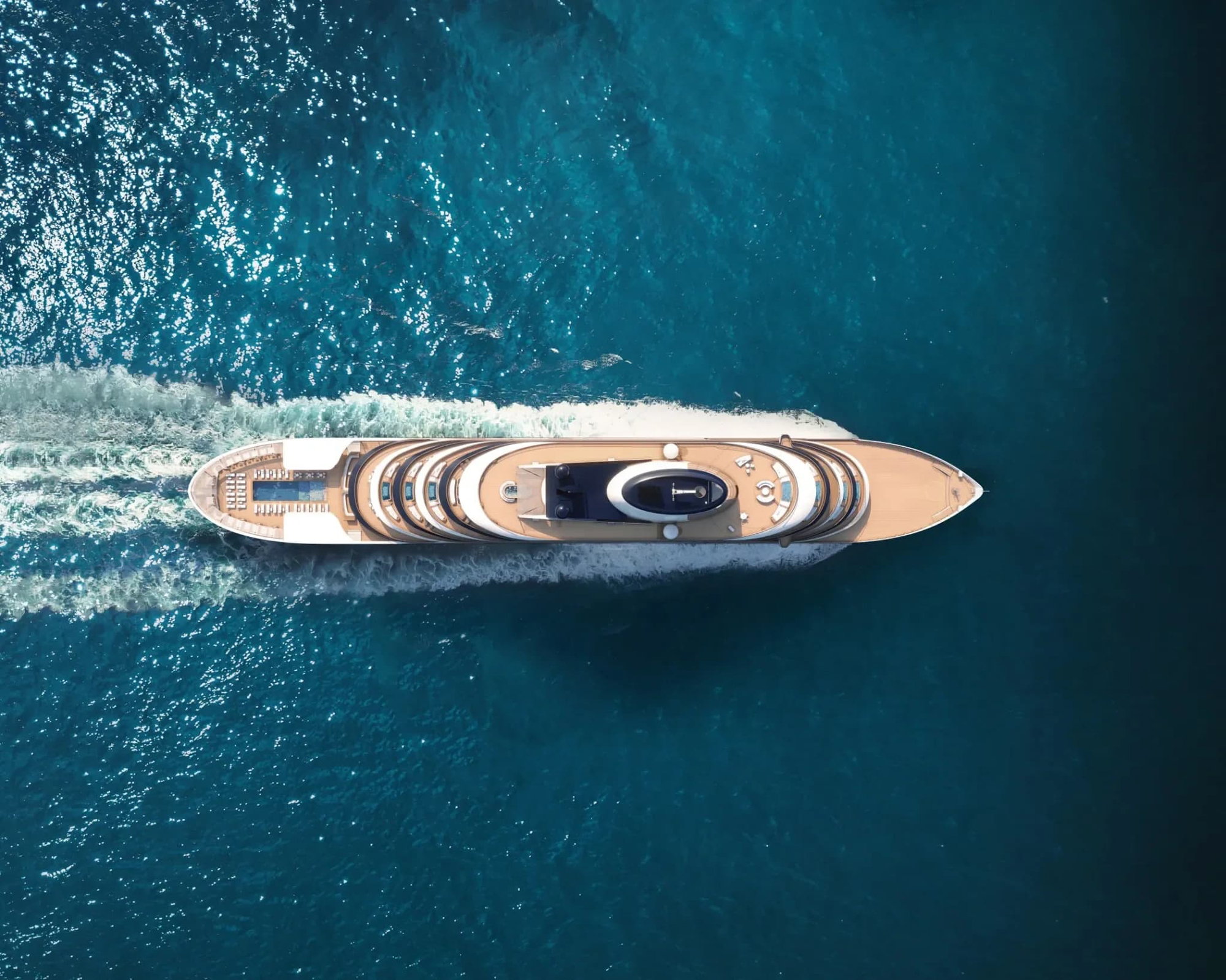 Aerial view of Four Seasons I luxury yacht cruising through azure waters