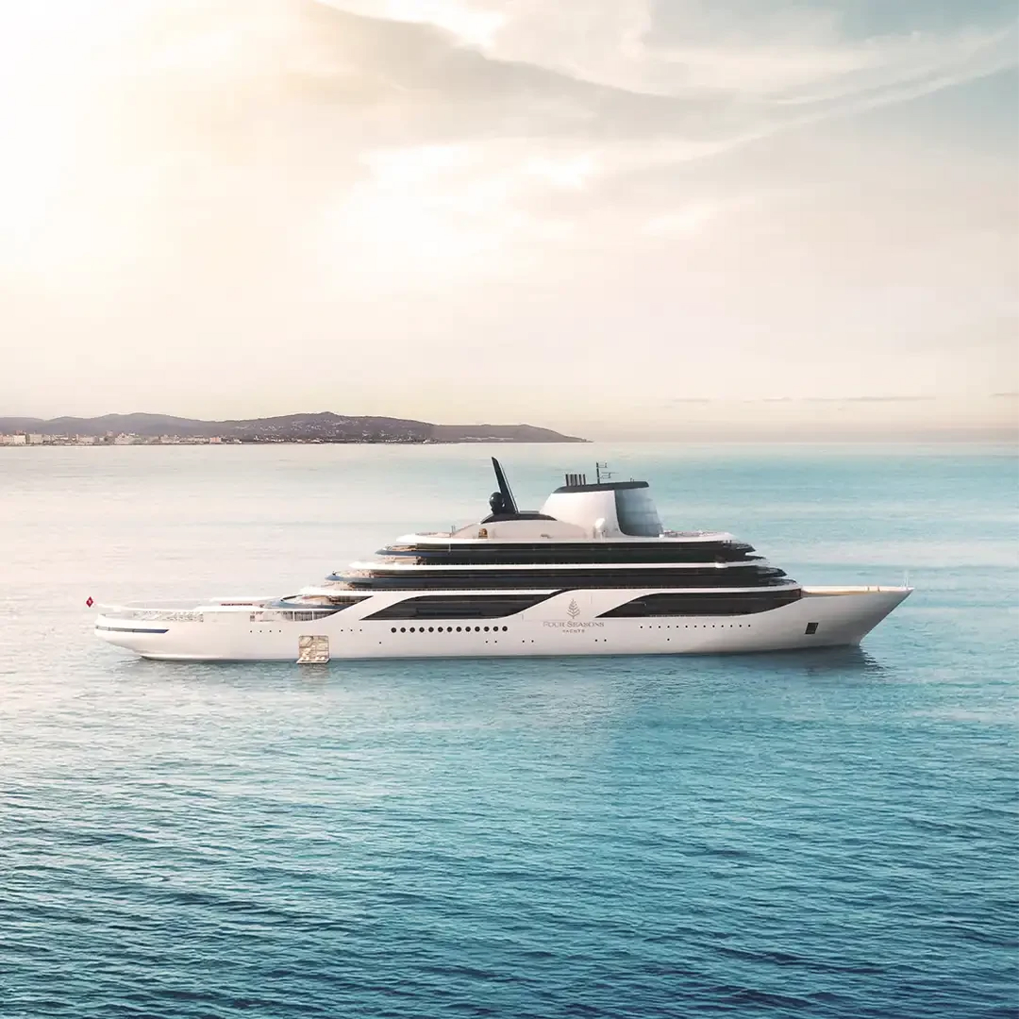 Four Seasons I luxury yacht sailing near a coastal horizon
