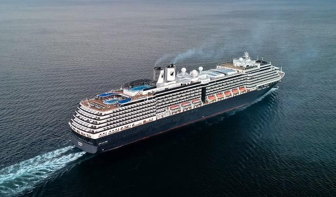 Modern Cruise Ship Sailing Open Waters A large, sleek cruise ship navigating across a calm blue ocean, viewed from an aerial perspective