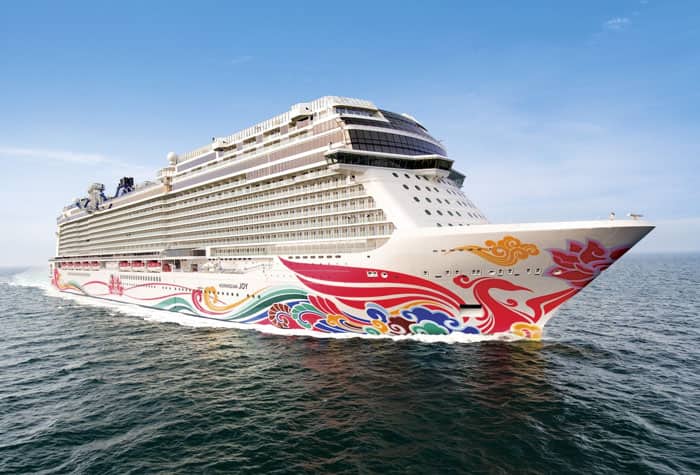 Norwegian Cruise Ship at Sea Norwegian Cruise Line ship with colorful hull design sailing on open water