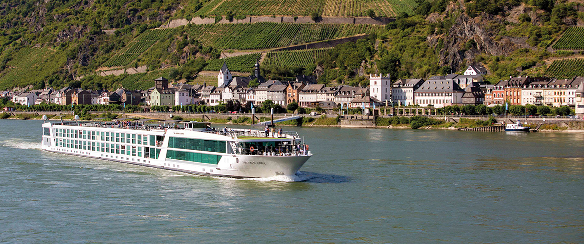 River cruise along the Rhine Valley with lush hillsides