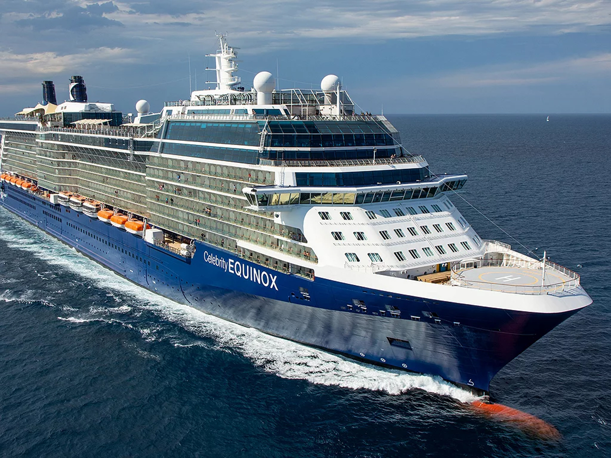 Celebrity Equinox Cruise Ship at Sea Celebrity Equinox cruise ship at sea with distinctive blue hull and white superstructure