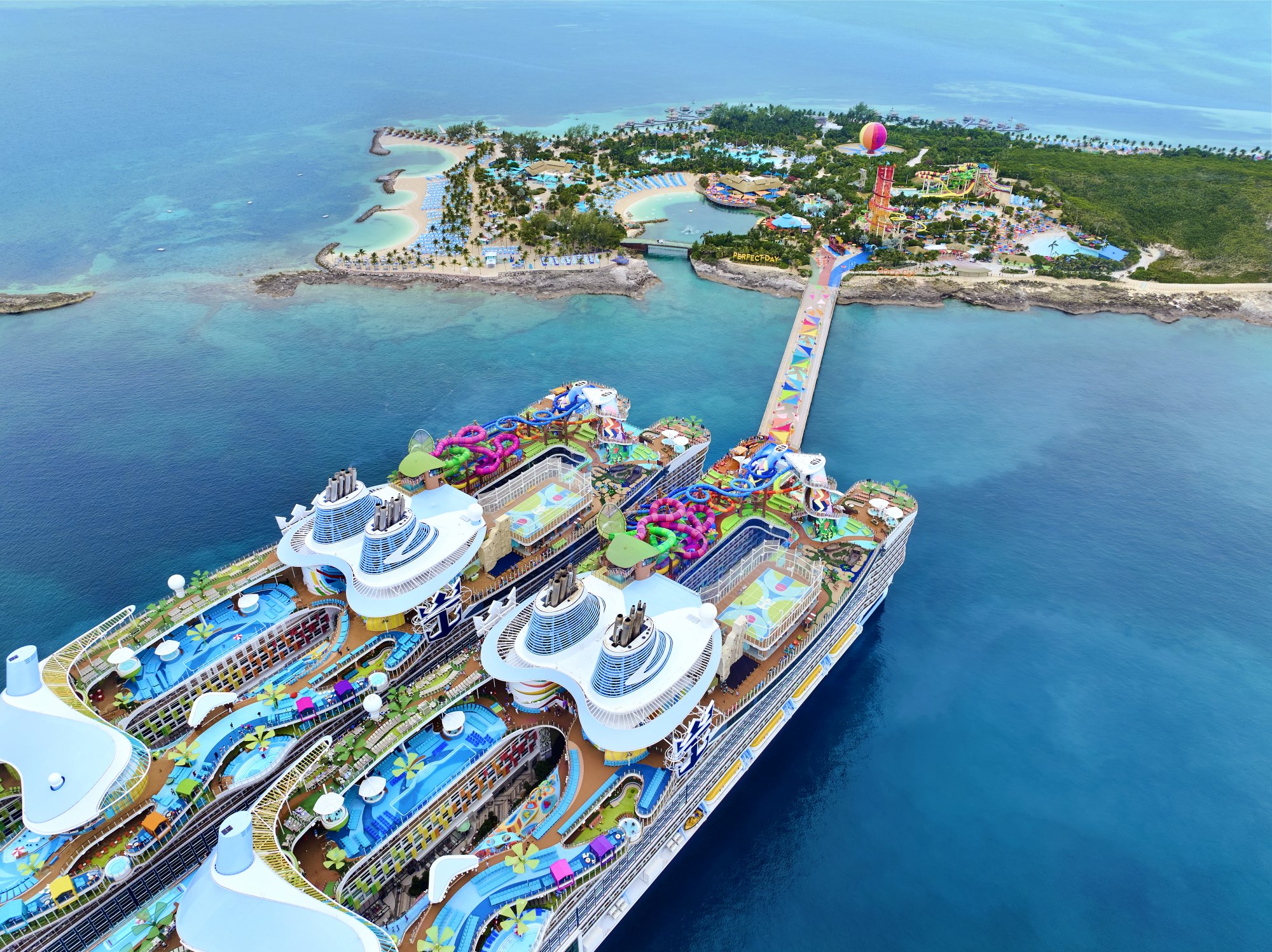 Aerial view of multiple Royal Caribbean cruise ships docked at Perfect Day at CocoCay private island in the Bahamas