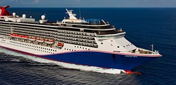 A large modern cruise ship operated by Carnival Cruise Lines sailing on open ocean waters