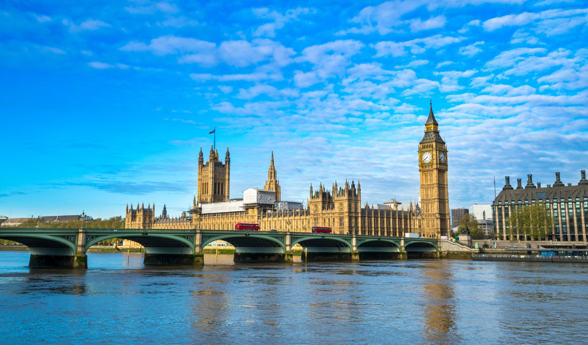 An iconic daytime view of the Palace of Westminster and Big Ben clock tower in London