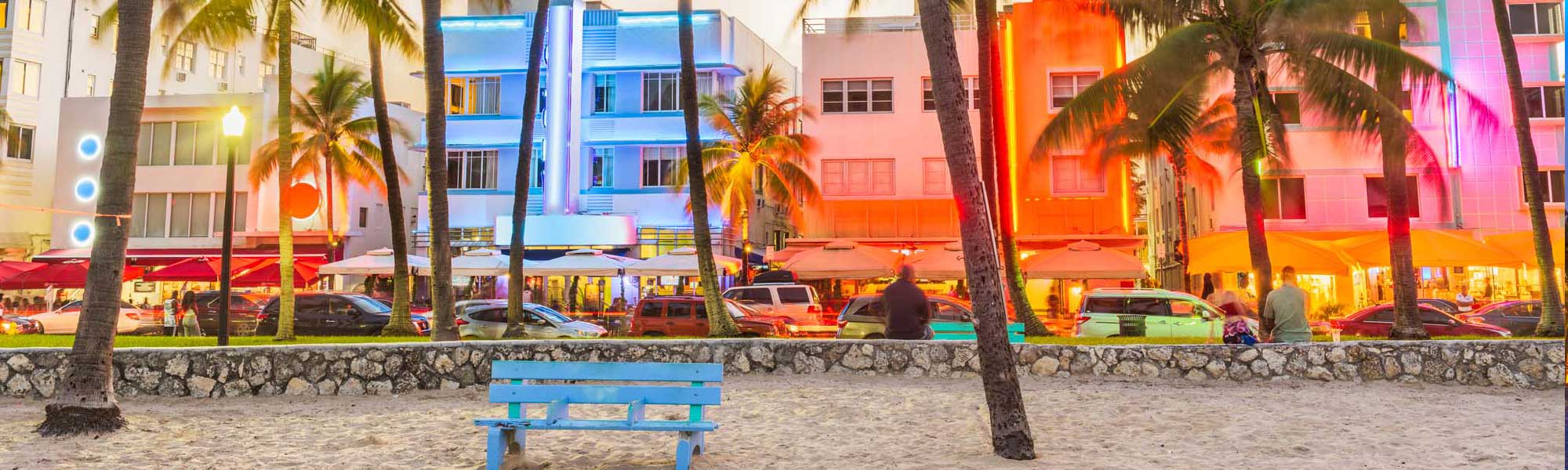 Miami Beach Art Deco Historic District at Dusk A vibrant evening scene of Miami's iconic Art Deco Historic District featuring pastel-colored