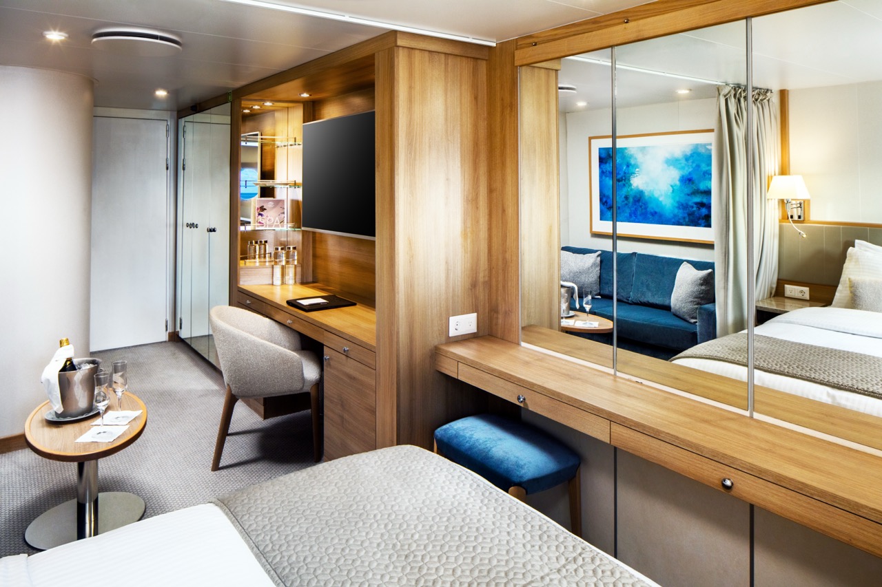 SeaDream luxury yacht in a scenic harbor setting