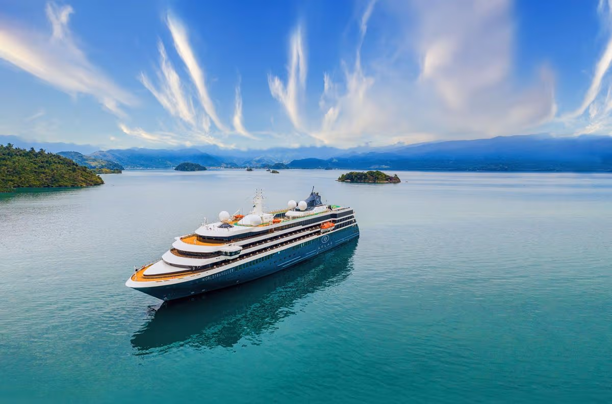 Viking expedition cruise ship navigating through Antarctic waters with glaciers in background